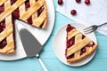 Delicious fresh cherry pie served on light blue wooden table, flat lay Royalty Free Stock Photo