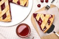 Delicious fresh cherry pie served on white wooden table, flat lay Royalty Free Stock Photo