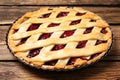 Delicious fresh cherry pie on wooden table Royalty Free Stock Photo