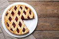 Delicious fresh cherry pie on wooden table, flat lay Royalty Free Stock Photo