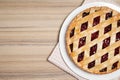 Delicious fresh cherry pie on wooden table, top view. Royalty Free Stock Photo