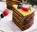 Delicious fresh chocolate cake with berries on wooden table Royalty Free Stock Photo