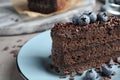 Delicious fresh chocolate cake with blueberries on table Royalty Free Stock Photo