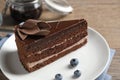 Delicious fresh chocolate cake on wooden table Royalty Free Stock Photo