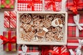 Delicious fresh Christmas decorated gingerbread cookies placed in wooden crate