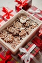 Delicious fresh Christmas decorated gingerbread cookies placed in wooden crate