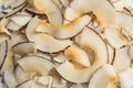 Delicious fresh coconut chips as background Royalty Free Stock Photo