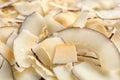 Delicious fresh coconut chips as background Royalty Free Stock Photo