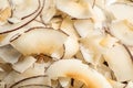 Delicious fresh coconut chips as background Royalty Free Stock Photo