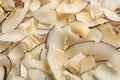 Delicious fresh coconut chips as background, closeup Royalty Free Stock Photo