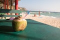 A delicious fresh coconut drink on the green table. Royalty Free Stock Photo