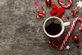 Delicious fresh festive morning coffee in a ceramic cup with little wrapped gifts, ornament and xmas toy. Cup of coffee