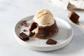 Delicious fresh fondant with hot chocolate centre and ice cream scoop on the plate. Lava cake recipe, menu. Close up Royalty Free Stock Photo