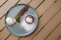 Delicious fresh fondant with hot chocolate and ice cream and mint served on plate. Lava cake recipe. Wooden background. Royalty Free Stock Photo