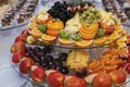 Delicious fresh fruits on plate on table at wedding reception in restaurant. luxury catering Royalty Free Stock Photo