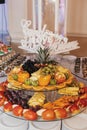 Delicious fresh fruits on plate on table at wedding reception in restaurant. luxury catering Royalty Free Stock Photo