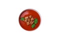 Delicious fresh gazpacho with breadcrumbs, salt and spices in a ceramic plate