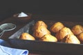 Fresh pastries in a baking tray. Delicious fresh homemade banana muffins in a baking tray Royalty Free Stock Photo