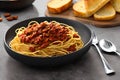 Delicious fresh homemade spaghetti bolognaise with salad and garlic bread Royalty Free Stock Photo