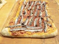 Delicious Italian anchovies pizza, cooked in the wood oven