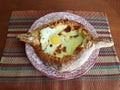 Delicious fresh Khachapuri prepared for lunch by a grandmother in the village