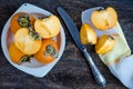 Delicious fresh persimmon fruit on wooden table