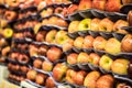 Fresh picked red ripe apples in stacks