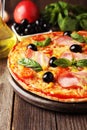 Delicious fresh pizza on brown wooden background. Royalty Free Stock Photo