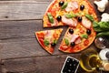 Delicious fresh pizza on brown wooden background Royalty Free Stock Photo