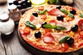 Delicious fresh pizza on brown wooden background Royalty Free Stock Photo