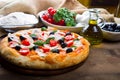 Delicious fresh pizza served on wooden table Royalty Free Stock Photo