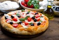 Delicious fresh pizza served on wooden table Royalty Free Stock Photo