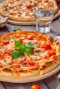 Delicious fresh pizza served on wooden table Royalty Free Stock Photo