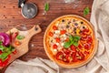 Delicious fresh pizza served on wooden table Royalty Free Stock Photo