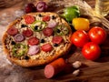 Delicious fresh pizza on a wooden background