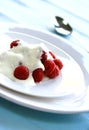 Delicious fresh raspberries served with yogurt Royalty Free Stock Photo