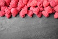 Delicious fresh ripe raspberries on black table, top view. Space for text Royalty Free Stock Photo