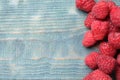 Delicious fresh ripe raspberries on blue table, top view. Space for text Royalty Free Stock Photo