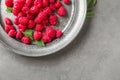Delicious fresh ripe raspberries on plate Royalty Free Stock Photo