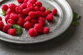 Delicious fresh ripe raspberries on plate Royalty Free Stock Photo