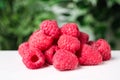 Delicious fresh ripe raspberries on white wooden table, closeup Royalty Free Stock Photo