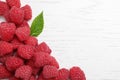 Delicious fresh ripe raspberries on white wooden table, top view. Space for text Royalty Free Stock Photo