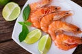 Delicious fresh seafood shrimp with lime on wooden