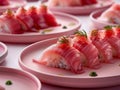 Delicious Fresh Sushi Platter with Sliced Fish, Rice, and Garnish on Elegant Pink Plates for Culinary Delights Royalty Free Stock Photo