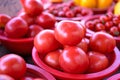 Delicious fresh tomatoes fruit vegetable food in red plastic basket at tradition market afternoon, Seoul, South Korea, harvest Royalty Free Stock Photo