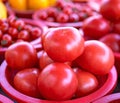 Delicious fresh tomatoes fruit vegetable food in red plastic basket at tradition market afternoon, Seoul, South Korea, harvest Royalty Free Stock Photo