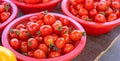 Delicious fresh tomatoes fruit vegetable food in red plastic basket at tradition market afternoon, Seoul, South Korea, harvest Royalty Free Stock Photo