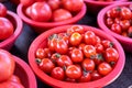 Delicious fresh tomatoes fruit vegetable food in red plastic basket at tradition market afternoon, Seoul, South Korea, harvest Royalty Free Stock Photo