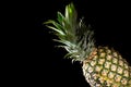 Delicious fresh yellow pineapple tropical fruit on black background