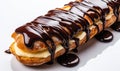 Delicious Freshly Baked Eclair with Smooth Shiny Chocolate Glaze Drizzled Over the Top Isolated on a White Background